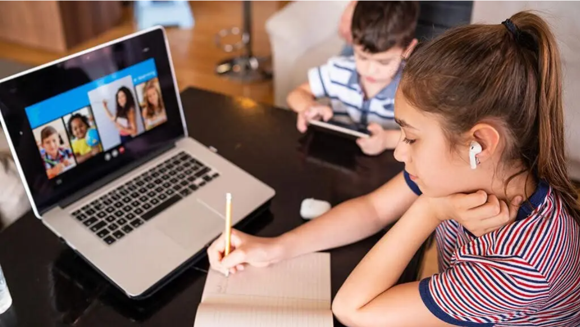 Child studying online school laptop Child studying online school laptop